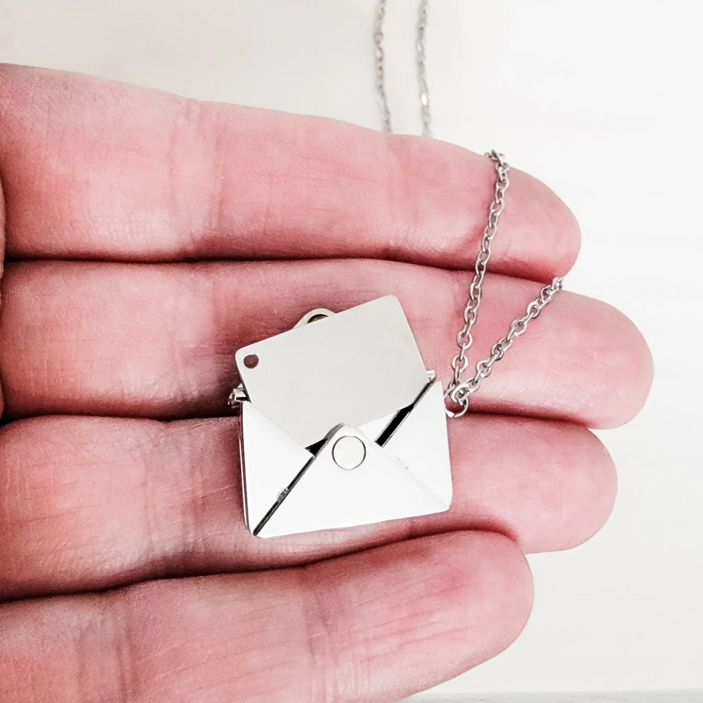 Envelope with letter necklace